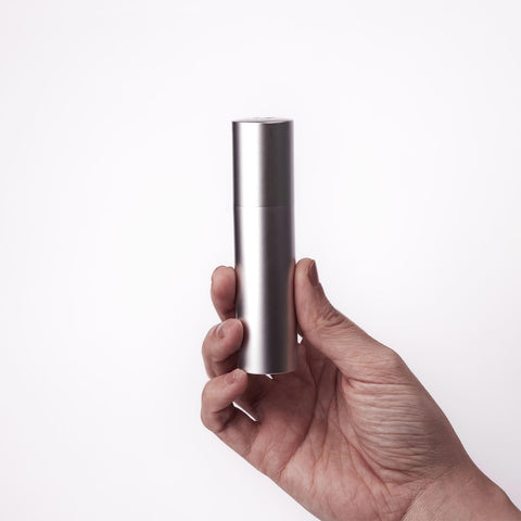 Überlube Good-to-Go silver travel case held in one hand